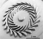 A picture containing metalware, gear Description automatically generated